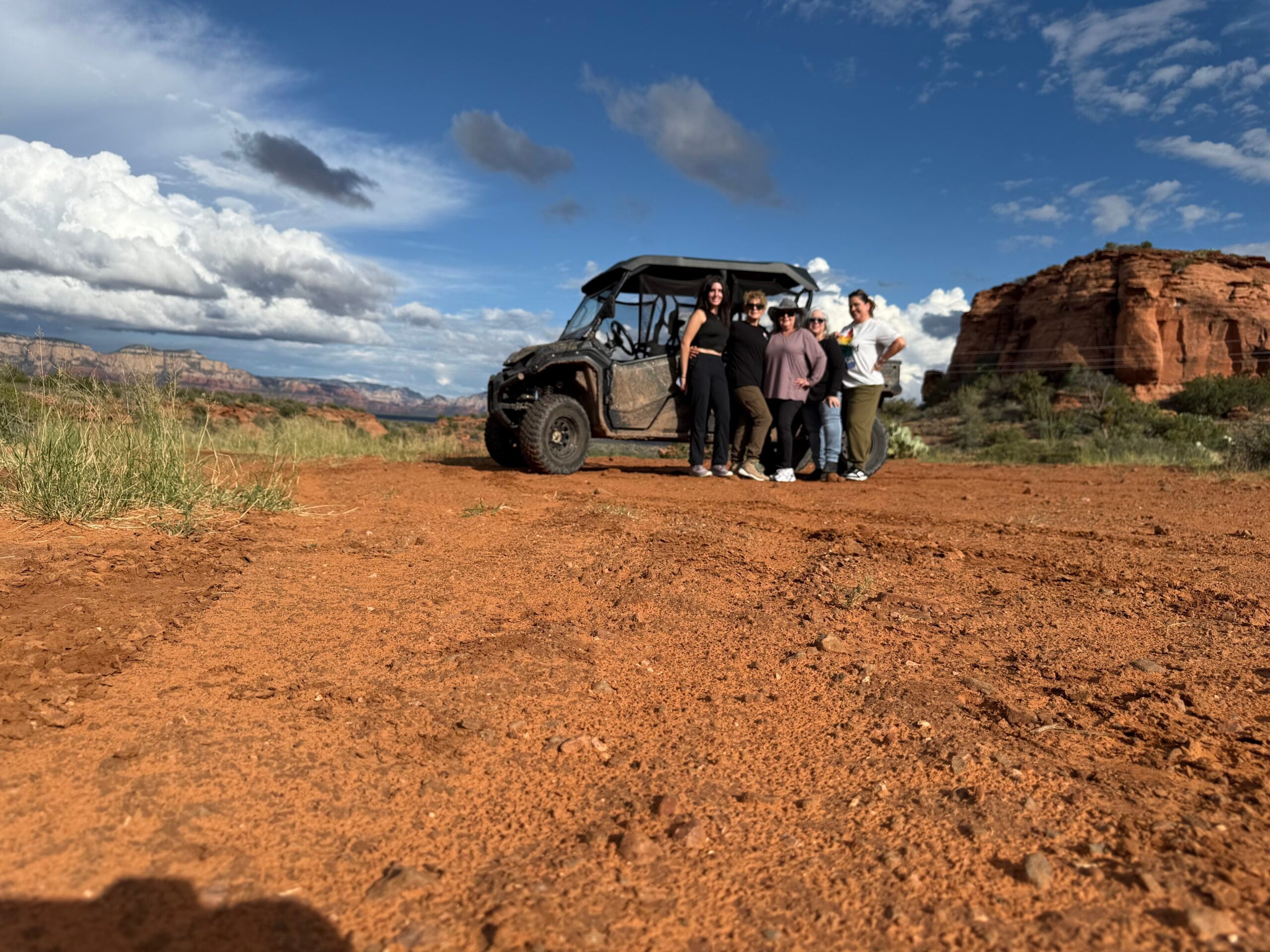 Family riding a UTV rental through Sedona backcountry