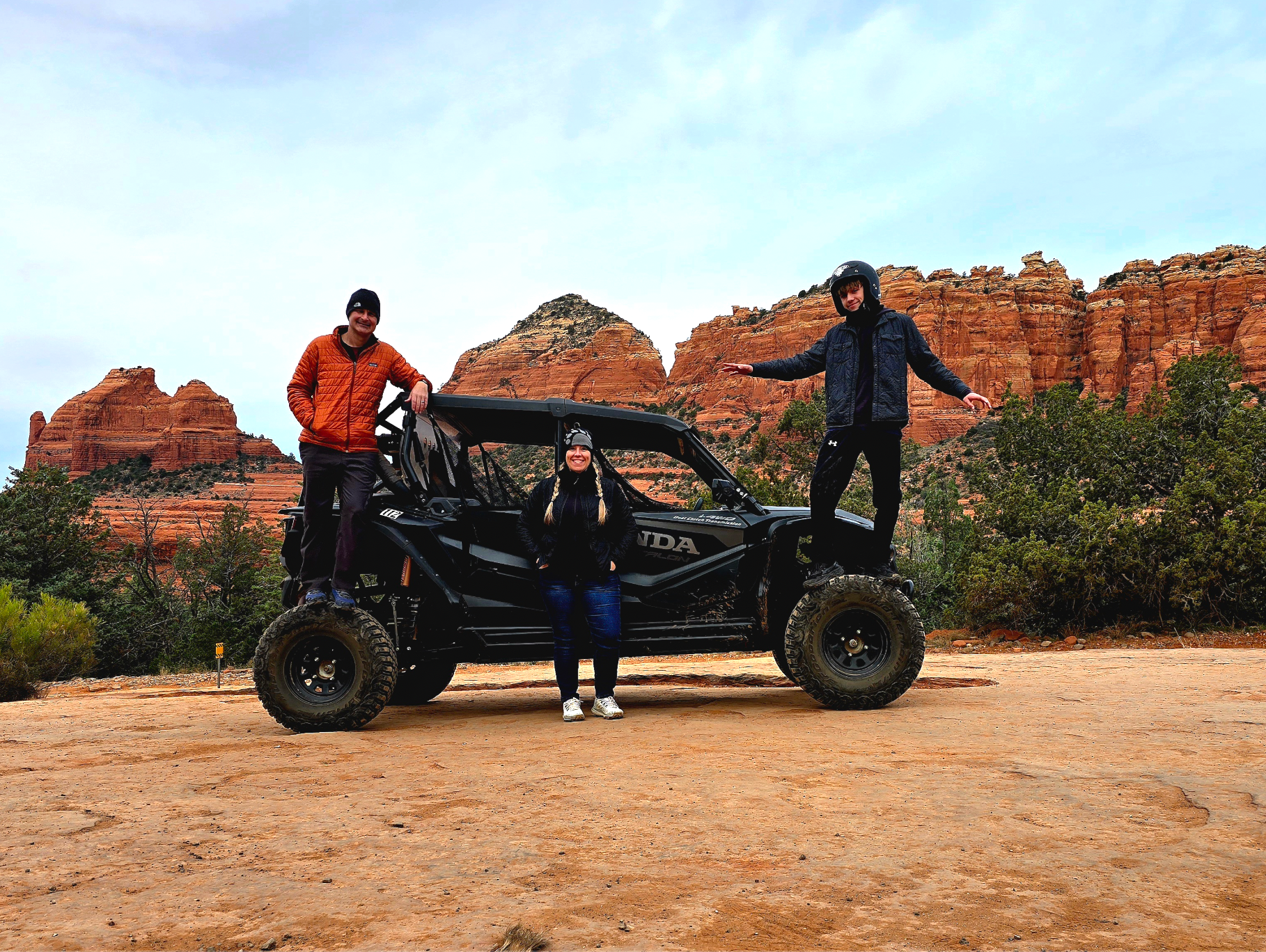 Family riding a UTV rental through Sedona backcountry