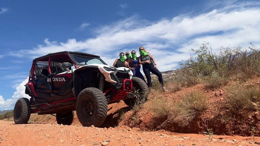 Family riding a UTV rental through Sedona backcountry