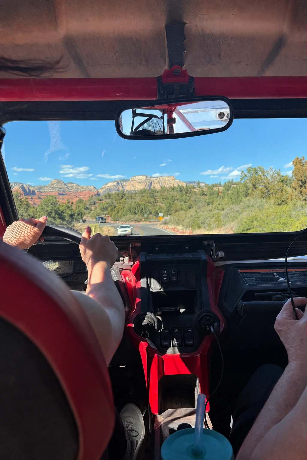 Family riding a UTV rental through Sedona backcountry